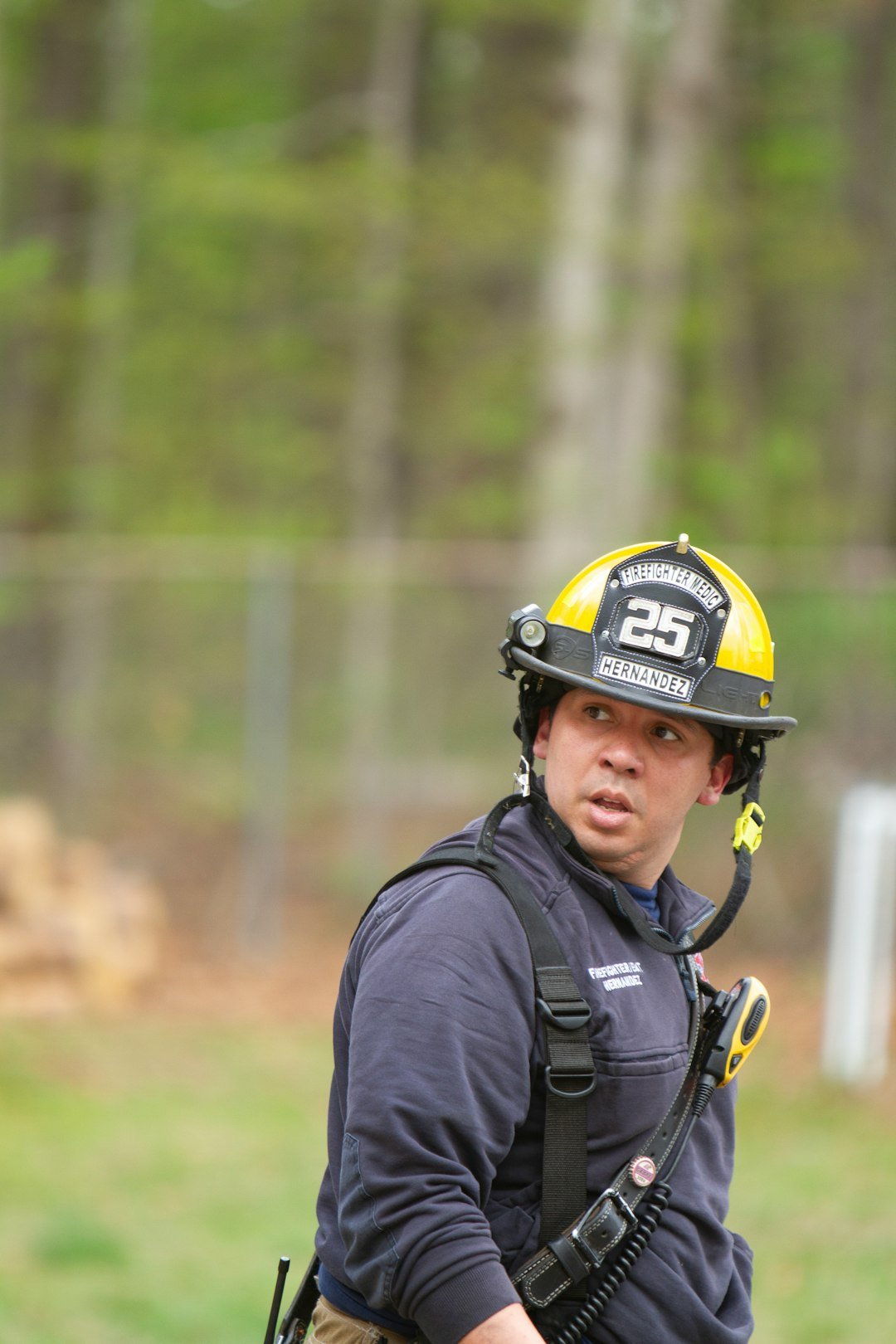 firefighter-in-helmet-looks-to-the-side-outdoors-u9jeap2hjag