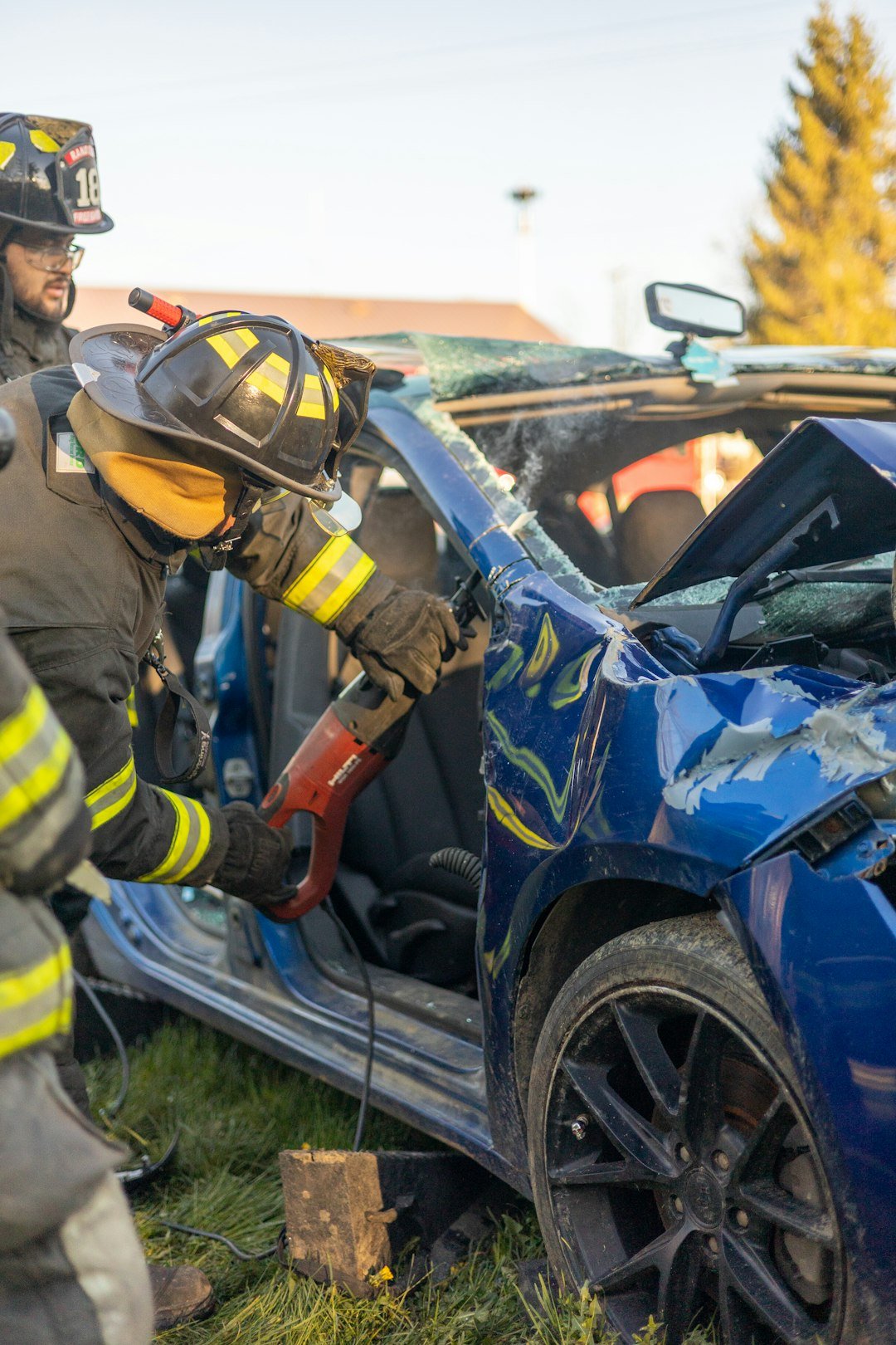 Firefighter with a wrecked car