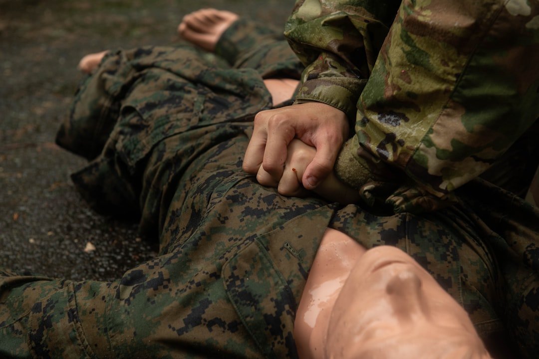 soldier-performing-chest-compressions-on-another-soldier-d1wy3tx9xwk